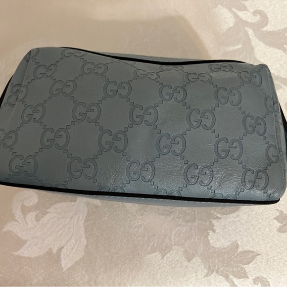 Gucci - authentic cosmetic pouch. Pairs beautifully with my Blue Coach handbag. - Picture 2 of 12